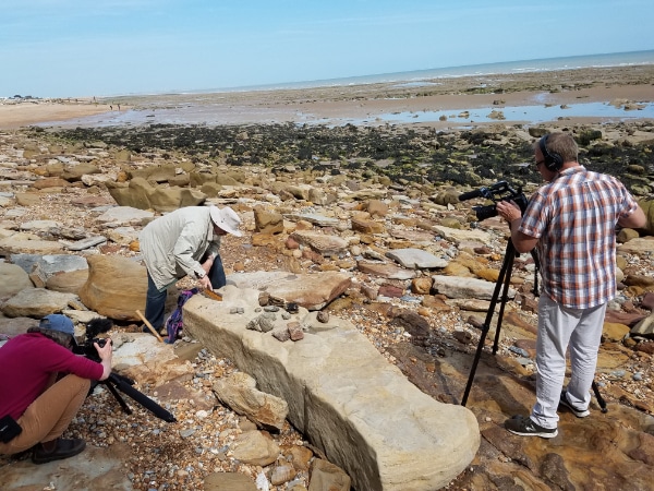 Crew shooting an amateur fossil hunter at the cliffs of Hastings. © 2024 Frank Frost Productions. All Rights Reserved. 